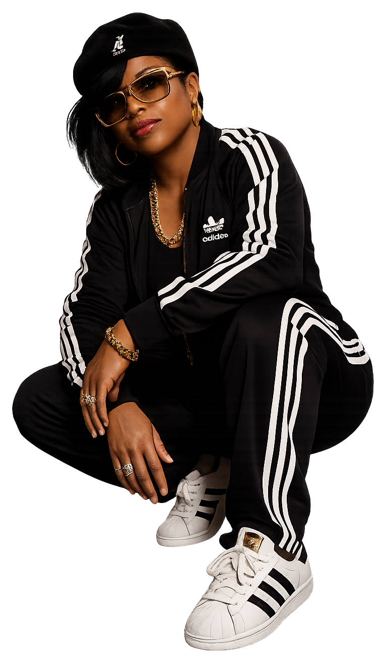 Mikini Williams, founder of DAY1044 Solutions, crouching in a black tracksuit and gold sunglasses